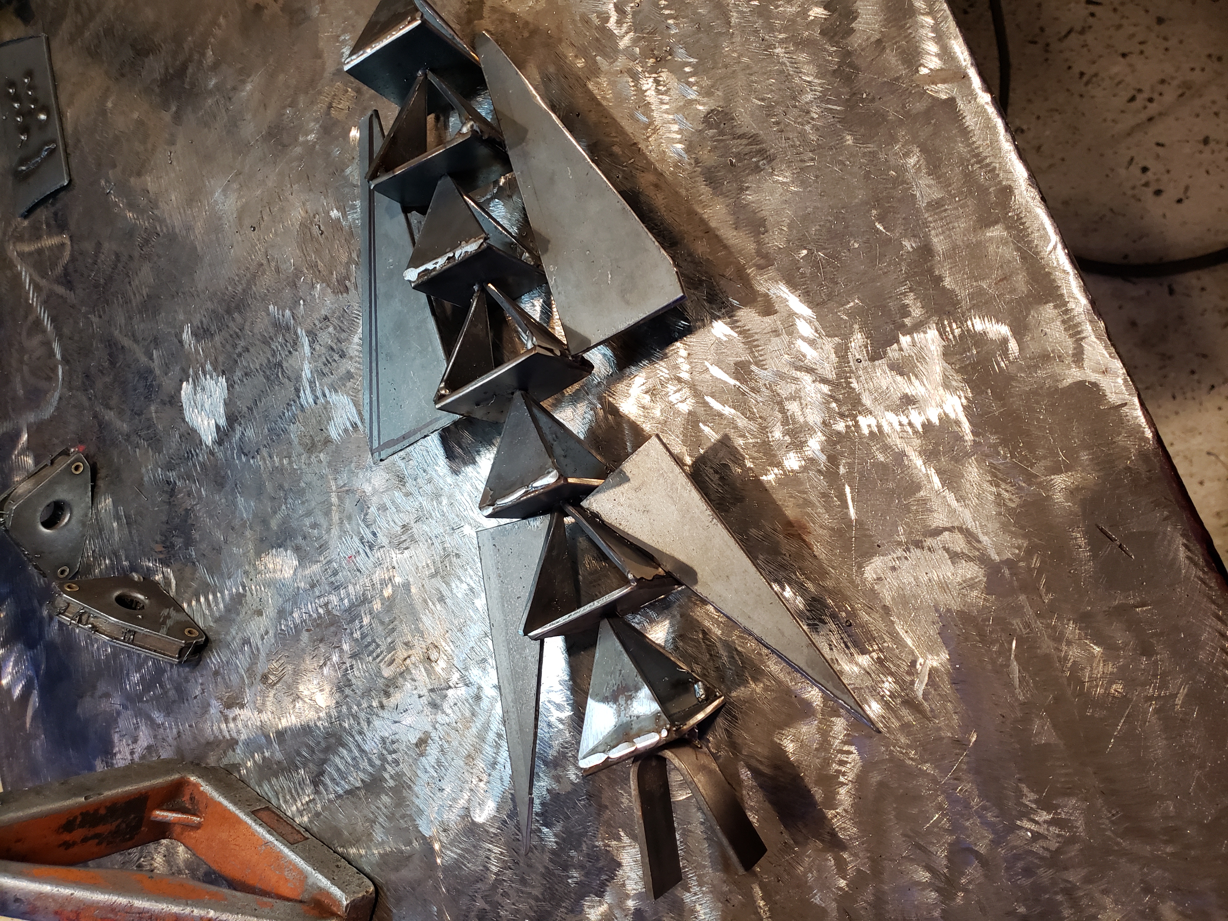 Welded angular steel forms on a fabrication table